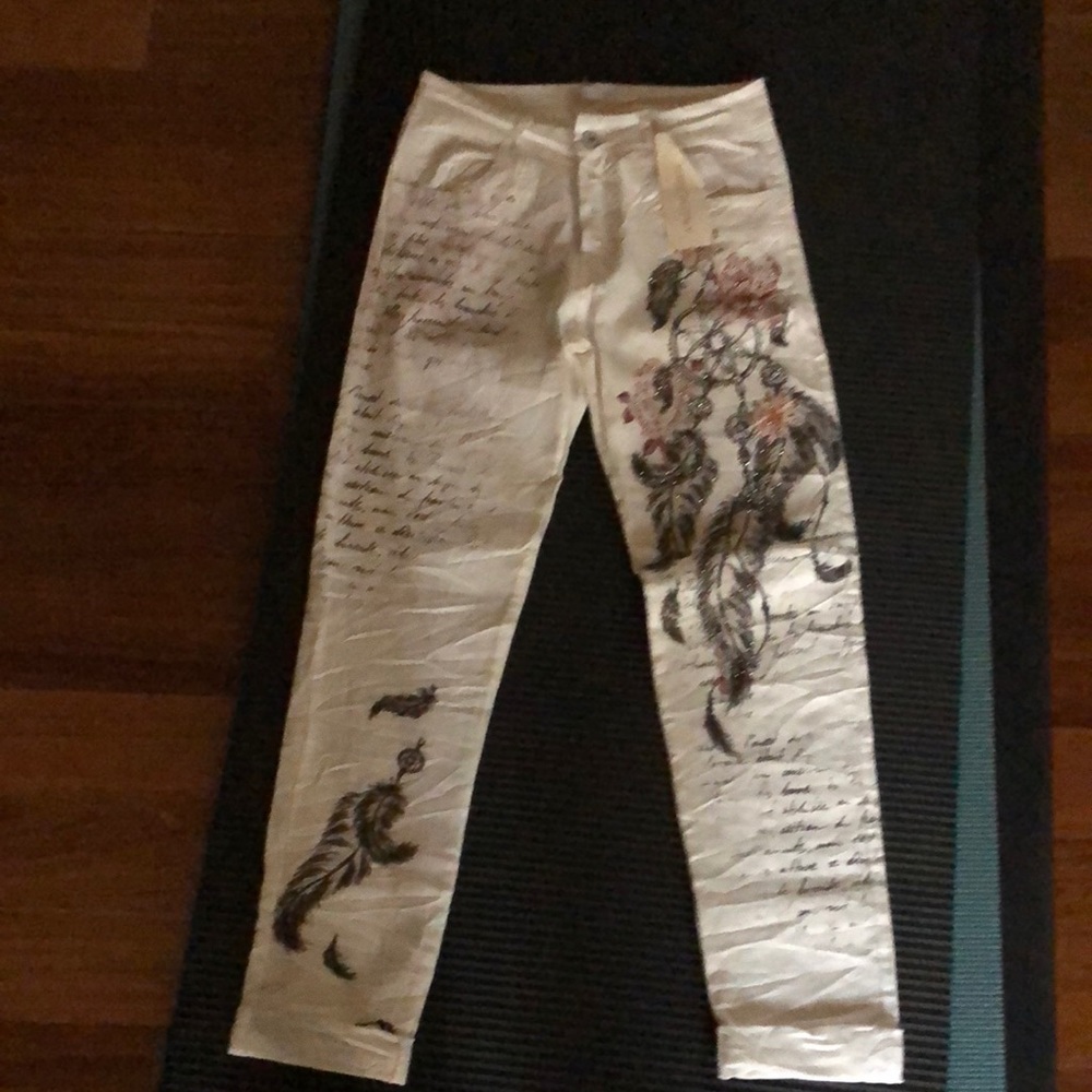 Never worn light pants , made in Italy